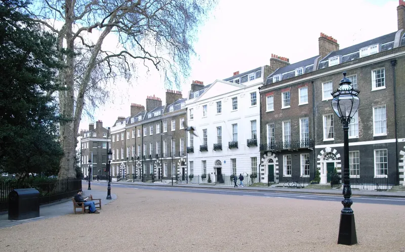 Georgian brick terrace on Bedford Square in Bloomsbury with arched doorways and sash windows